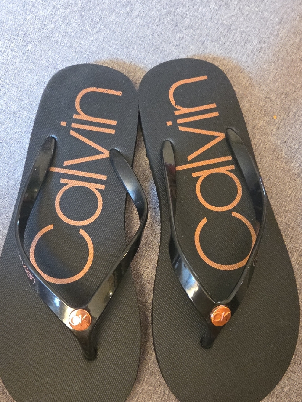 Calvin Klein Black Flip Flops with Copper Logo Print